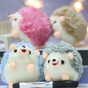 Detailed view of plush hedgehog keychains in pink, brown, blue and green soft fabric