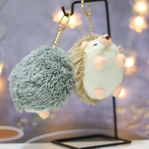 Cute hedgehog plush keychains in grey and brown with golden metal clips for bags