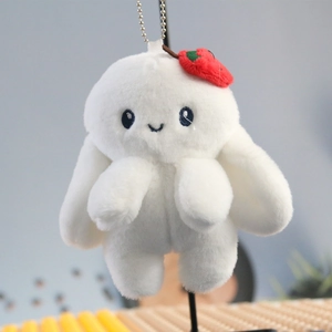 Cute white plush bunny keychain with red strawberry charm for backpack decoration