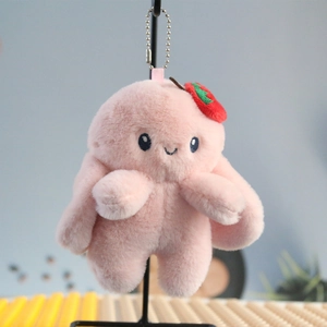 Detailed view of pink plush bunny pendant with soft faux fur and metallic bead chain