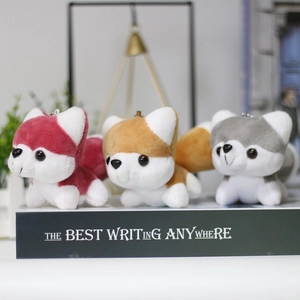 Three adorable plush husky pendants in red, brown, and grey with metal keyrings