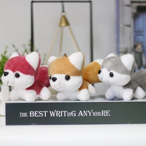 Close-up of cute husky plush keychain set in red, yellow and grey with metal rings