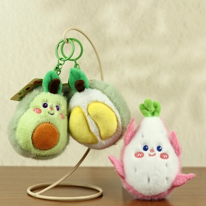 Detail of plush fruit pendants featuring avocado, durian, and dragon fruit with clips