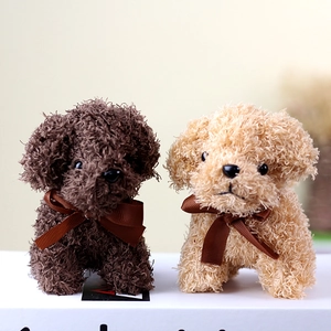 Plush Teddy dog stuffed toys in dark brown and beige with decorative silk ribbons