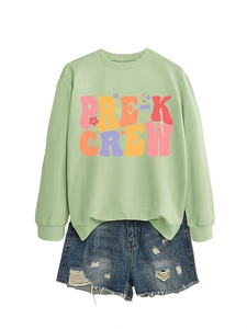 Detail of Pre-K Crew mint sweatshirt paired with distressed denim shorts on white backdrop