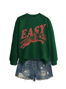 Detail of green tiger print sweatshirt with EASY text and distressed denim shorts