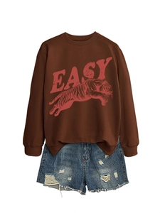 Detail of tiger print and red EASY letter on brown crewneck sweatshirt with side slits