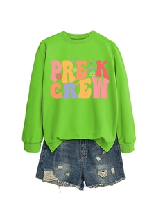 Flat lay of Pre-K Crew green sweatshirt with vintage floral print and ripped denim shorts