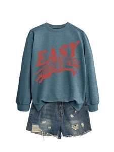 Detail of navy sweatshirt with red tiger print, EASY text, and ripped denim shorts