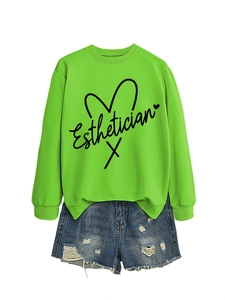 Detailed view of neon green Esthetician sweatshirt and distressed blue denim shorts