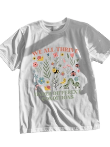 Detail view of floral and insect illustration on white round neck cotton t-shirt