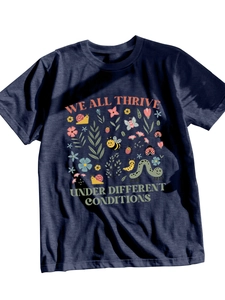 Detail of colorful floral and insect illustration on a navy blue cotton T-shirt
