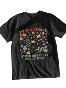 Close-up of black cotton T-shirt featuring colorful insects and floral print design