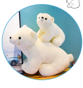 Detailed view of large and small polar bear plush toys with soft white faux fur texture