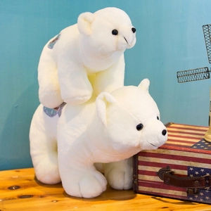 Set of two soft white polar bear plush toys with decorative blue floral embroidery