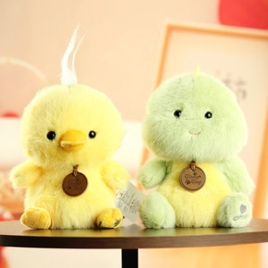 Cute plush animal dolls with soft fur and leather tags on warm yellow background