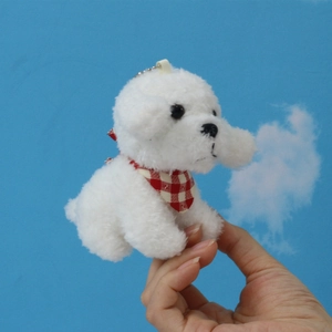 Plush white Bichon Frise puppy keychain toy with red plaid bandana shown in hand