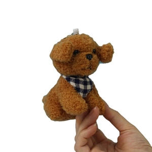 Realistic brown teddy dog plush keychain with a blue plaid scarf and metal clasp