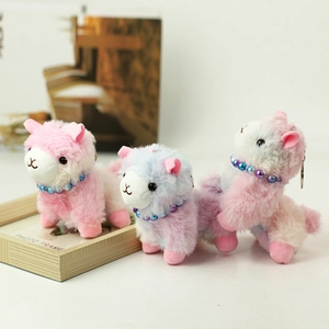 Three cute colorful plush alpaca keychains with rainbow bead necklaces and metal rings