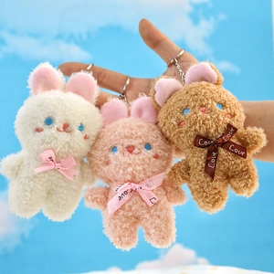 Tre simpatici ciondoli a forma di coniglio di peluche bianco rosa e marrone con nastro silk