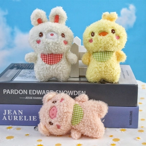 Plush bunny, bear and chick keychain pendants with checkered bibs on scenic background