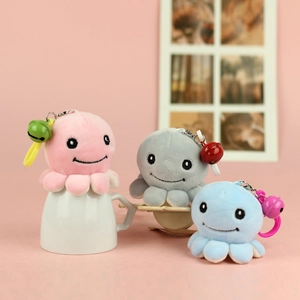 Three cute plush octopus keychains in pink, grey and blue with bells for bag charms