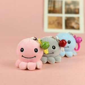 Three cute plush octopus keychains in pink, grey and blue with colorful bells