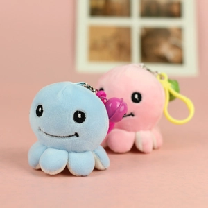Detailed view of blue and pink plush octopus keychains with fine embroidery and keyrings