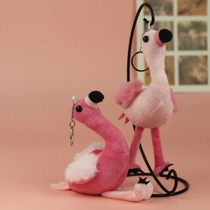 Detail of pink flamingo plush keychain with soft fur texture and metal ring attachment