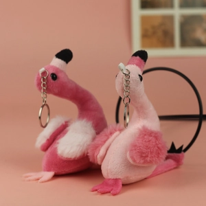 Close-up of cute plush flamingo keychains with soft faux fur and silver metal clips
