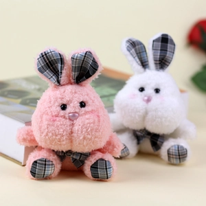 Detail of cute plush bunny charms with soft fur texture and checkered inner ear patterns