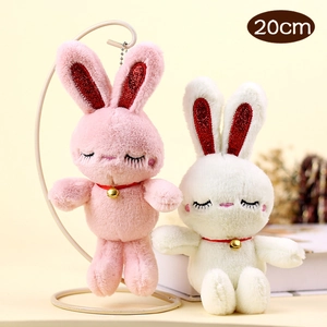 Detail of 20cm plush rabbits with sequined ears, ribbon collars and golden bells