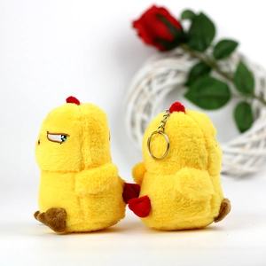 Detail view of funny plush chicken keychain featuring soft fabric and metal ring