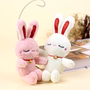 Cute plush rabbit keychain set in pink and white with golden bells and soft sleeping eyes