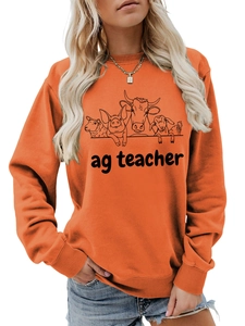 Close-up of the black animal line art and ag teacher print on the orange sweatshirt