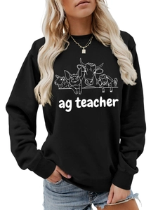 Close-up of ag teacher sweatshirt featuring white farm animal line art on black fabric