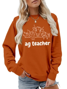 Burnt orange sweatshirt detail showing the farm animal line art and ag teacher print