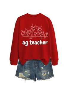 Detail of red crewneck sweatshirt with farm animal graphics and denim shorts