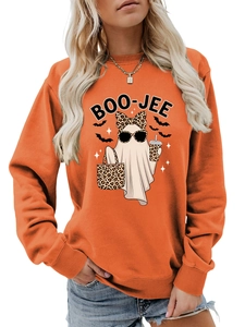 Detail of creative Halloween ghost and bat print on an orange long-sleeve sweatshirt