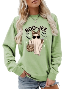 Detail of light green sweatshirt featuring a stylish leopard print ghost and bats design