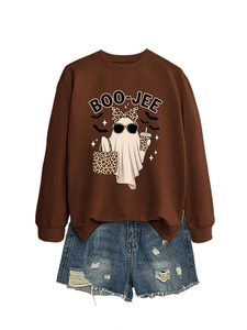 Close-up of the BOO-JEE ghost print on a brown crewneck sweatshirt with distressed denim shorts