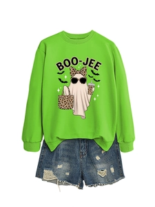 Detail of neon green BOO-JEE ghost sweatshirt paired with distressed denim fringe shorts