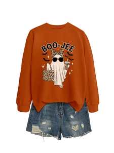 Detailed view of the BOO-JEE ghost print on an orange sweatshirt with denim shorts