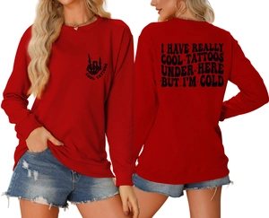 Detailed views of red crewneck sweatshirt with vintage I Have Really Cool Tattoos print