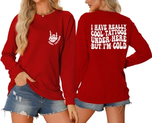 Detail of red crewneck sweatshirt featuring back slogan print and ribbed cuffs