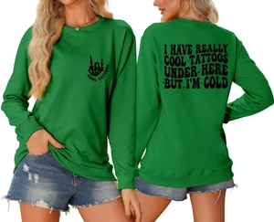 Front and back view of green crewneck sweatshirt with vintage tattoo slogans and graphics