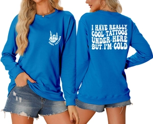 Close-up of electric blue sweatshirt with white slogan and back print detail