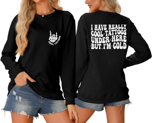 Detail of the back print on a black sweatshirt with white artistic lettering slogan