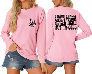 Close-up of pink sweatshirt featuring I Have Really Cool Tattoos back print and bone hand logo