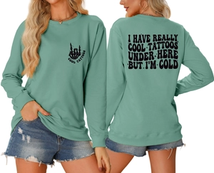 Front and back view of mint green crewneck sweatshirt with I Have Really Cool Tattoos print